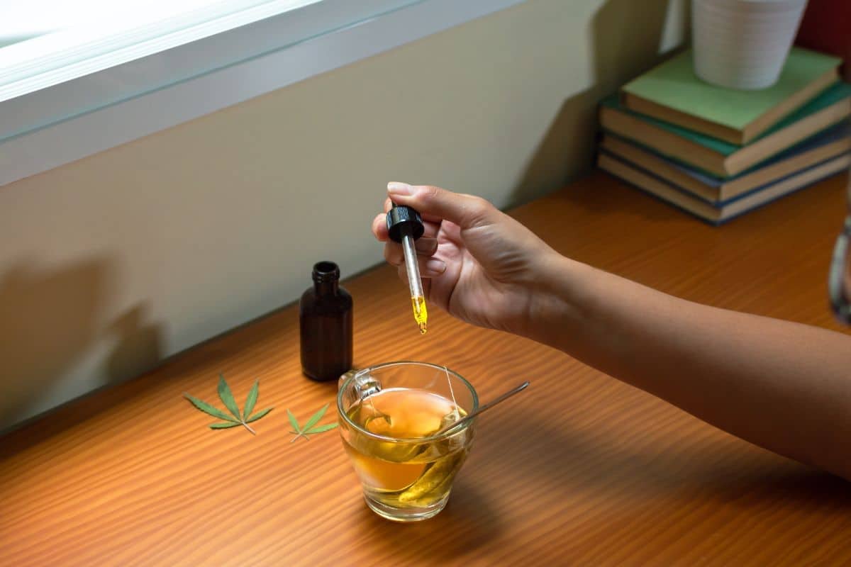 A lady having delta 8 tincture with her tea
